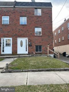 216 Boro Road, Unit A Secane, PA 19018 - Photo 1 of 14 a brick building with a yard