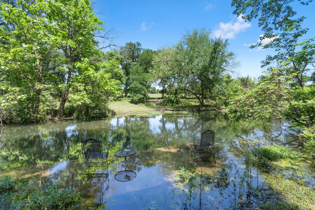 3231 Plainview Road Midlothian, TX 76065 - Photo 2 of 22 a view of a lake view with a garden