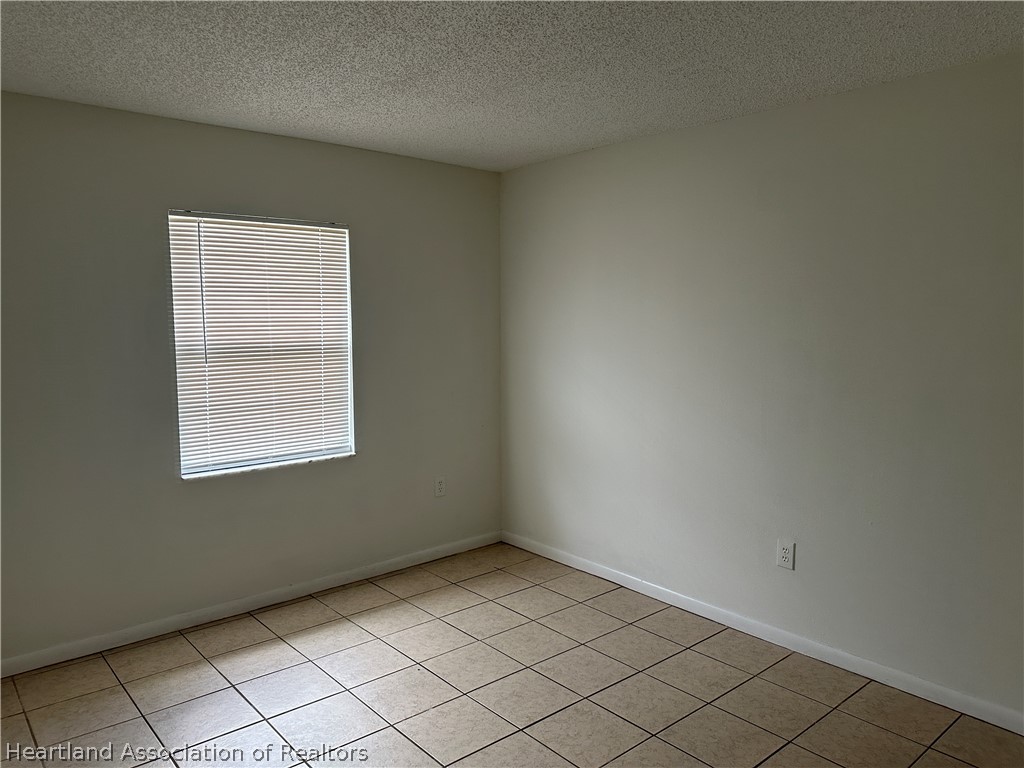 237 Rhapsody Avenue Lake Placid, FL 33852 - Photo 7 of 18 an empty room with windows