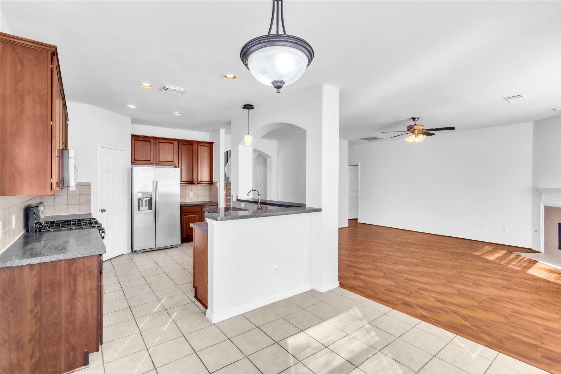 18027 Oak Orchard Lane Cypress, TX 77433 - Photo 14 of 37 a view of a kitchen with kitchen island a counter top space appliances and cabinets