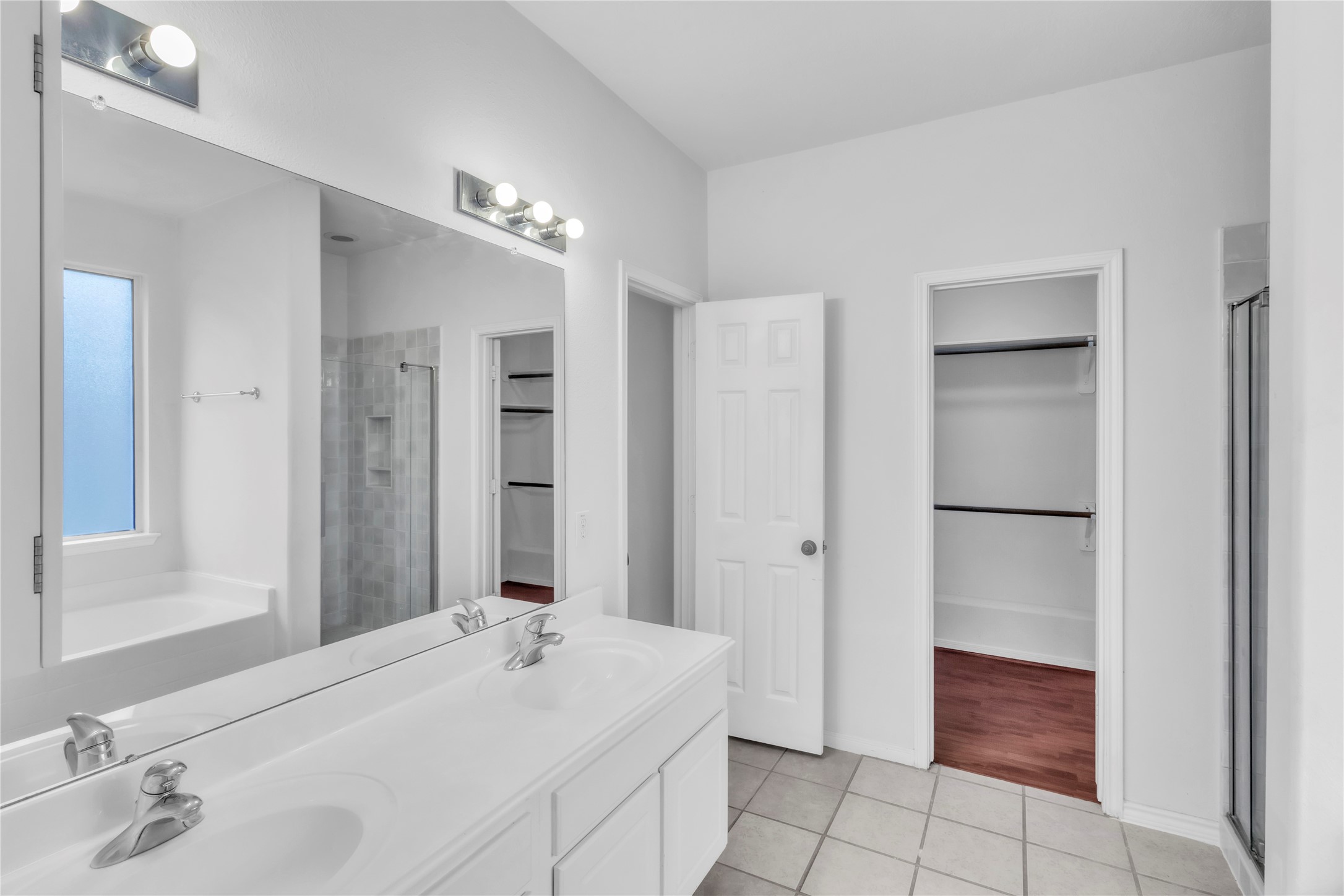 18027 Oak Orchard Lane Cypress, TX 77433 - Photo 19 of 37 a bathroom with a sink and a mirror