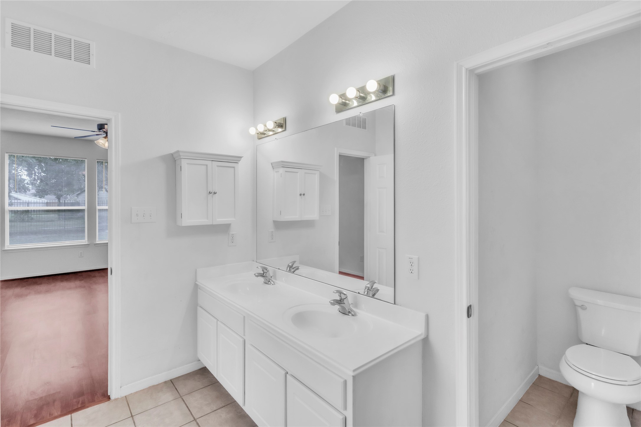 18027 Oak Orchard Lane Cypress, TX 77433 - Photo 21 of 37 a bathroom with a sink a toilet and shower