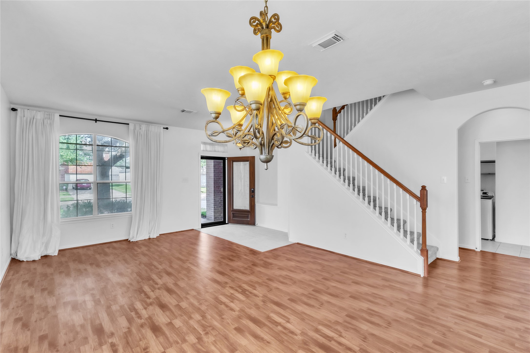 18027 Oak Orchard Lane Cypress, TX 77433 - Photo 6 of 37 a view of a room with wooden floor and chandelier