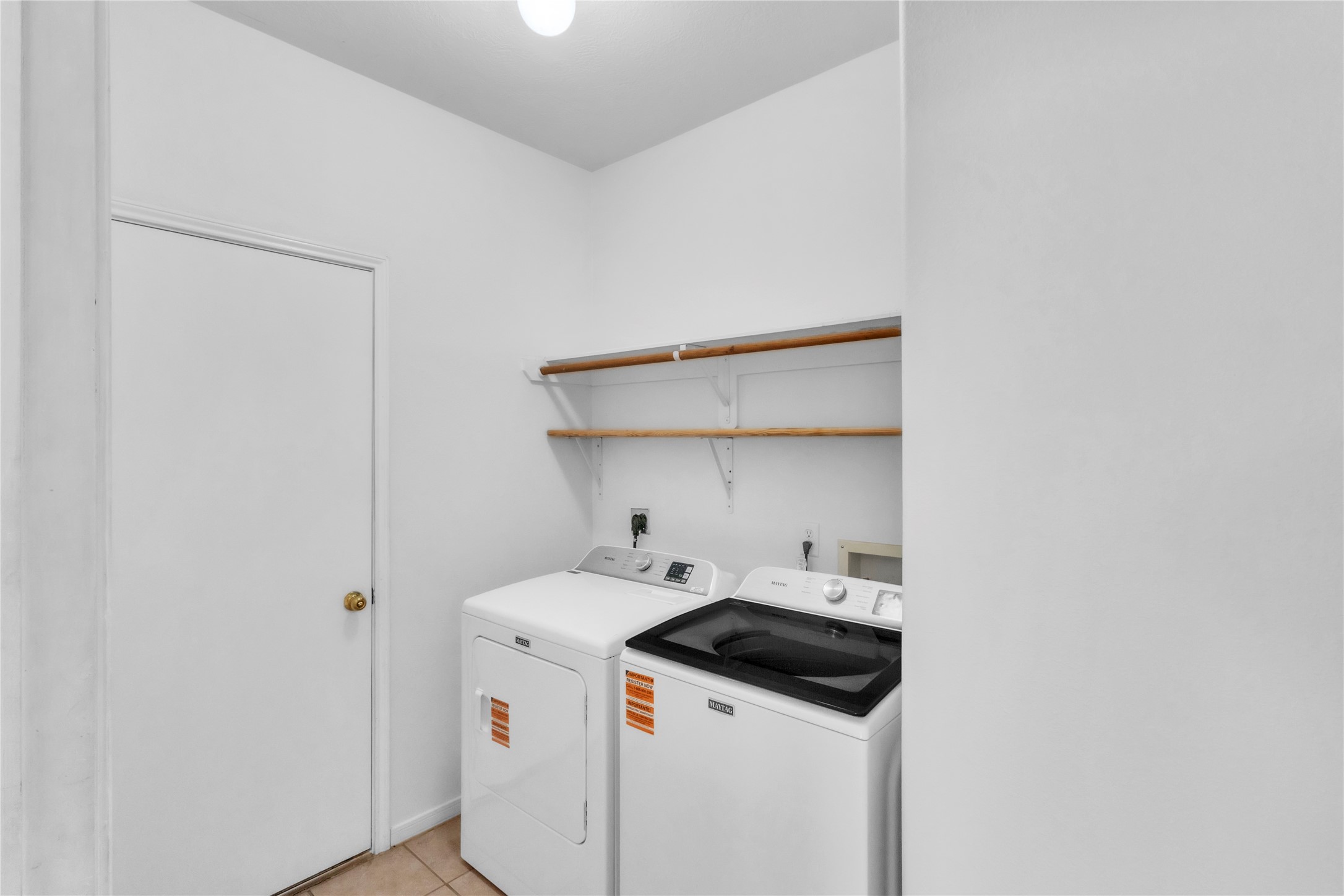 18027 Oak Orchard Lane Cypress, TX 77433 - Photo 9 of 37 a utility room with dryer and washer