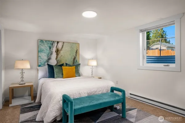 a bedroom with a bed and lamps