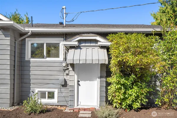 a view of a patio with two chairs and a table in a patio
