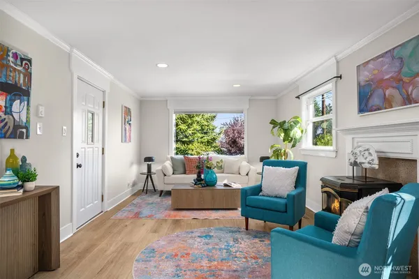 a living room with furniture and a fireplace