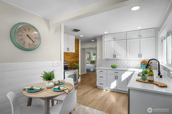 a kitchen with sink cabinets and wooden floor