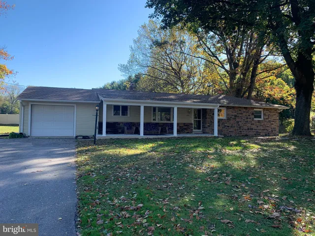 front view of a house with a garden