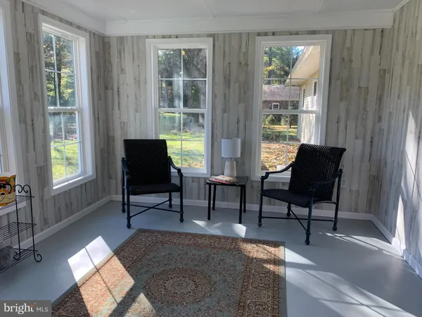 a view of a livingroom with furniture and front door