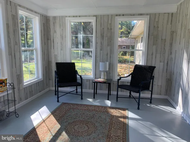 a view of a livingroom with furniture and front door