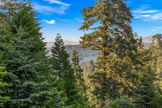 a view of a porch with furniture and wooden floor