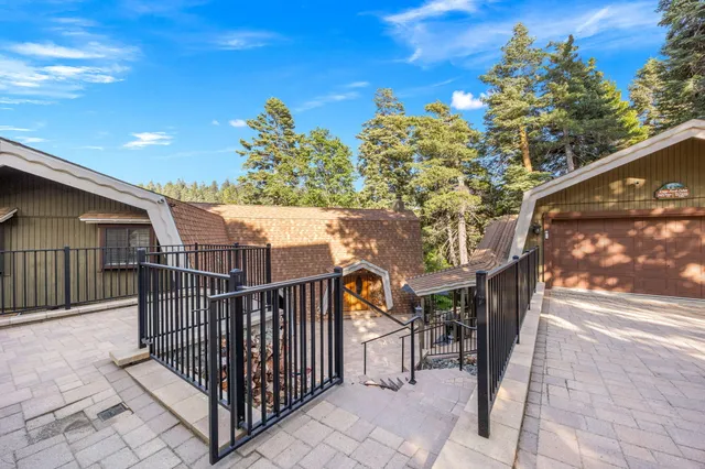 a living room with fireplace furniture and a flat screen tv