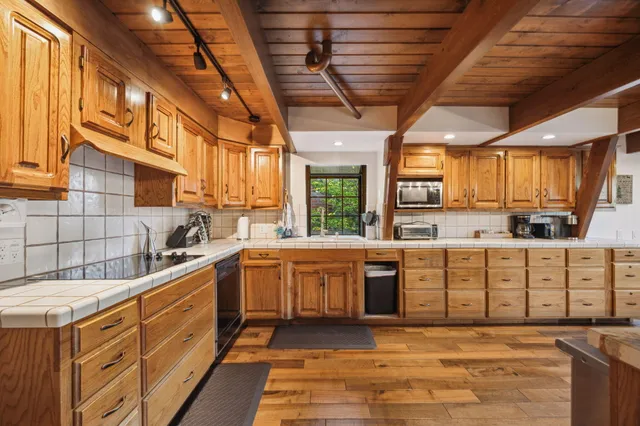 a view of a dining table and chairs in the patio