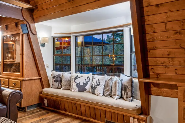 a view of balcony with wooden floor and outdoor seating