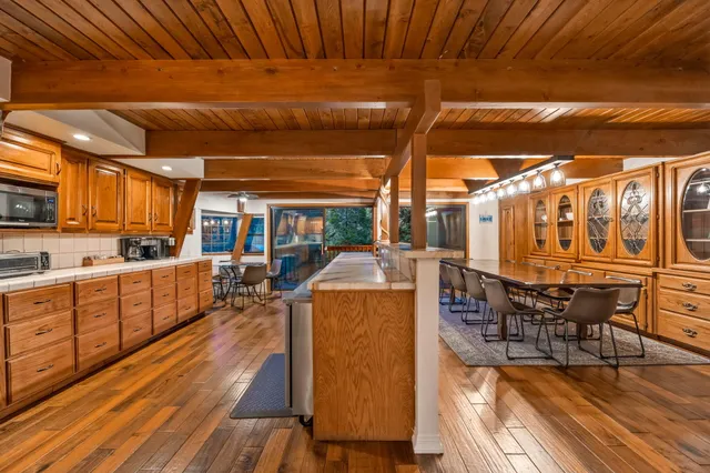 a view of a balcony with furniture and a potted plant