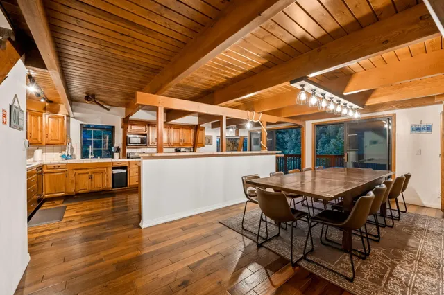 a view of a roof deck with furniture