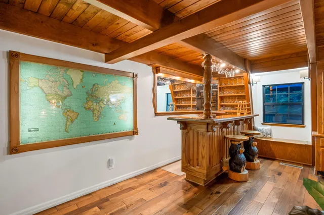 a view of backyard of house with green space