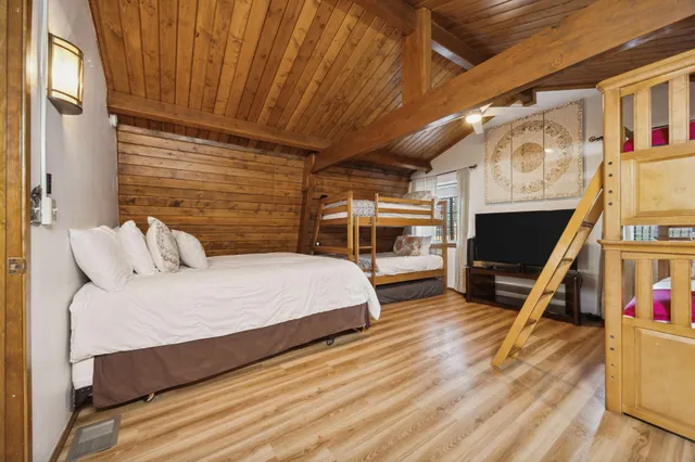 a kitchen with stainless steel appliances granite countertop a refrigerator and a stove