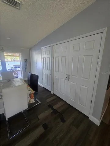 a view of a workspace with furniture