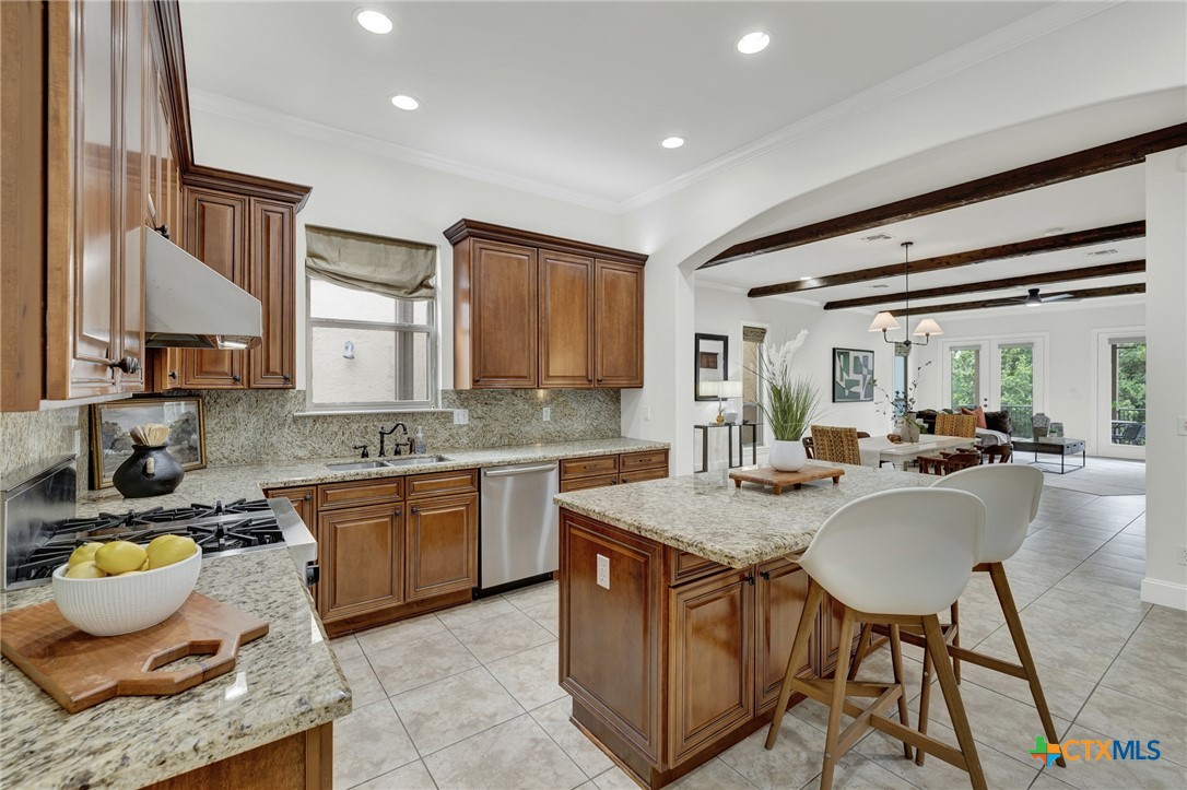 1029 Gruene Road New Braunfels, TX 78130 - Photo 15 of 48 a kitchen with a dining table chairs and sink