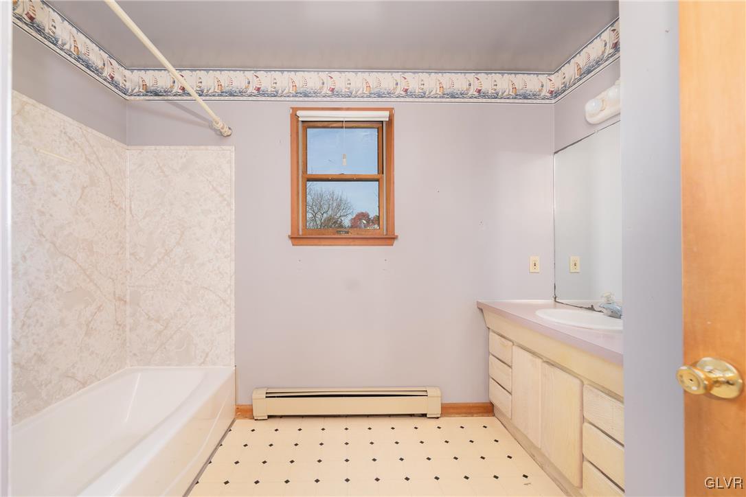 1597 Orchards Road Hellertown, PA 18055 - Photo 13 of 19 a bathroom with a sink a toilet and shower