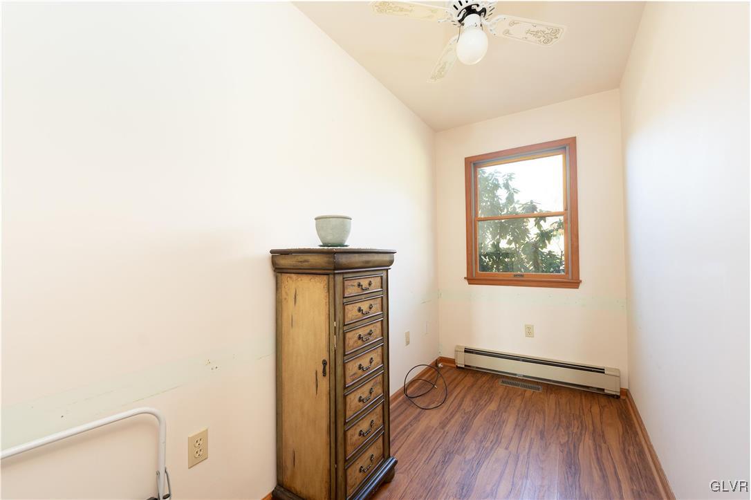 1597 Orchards Road Hellertown, PA 18055 - Photo 9 of 19 a view of empty room with window and wooden floor