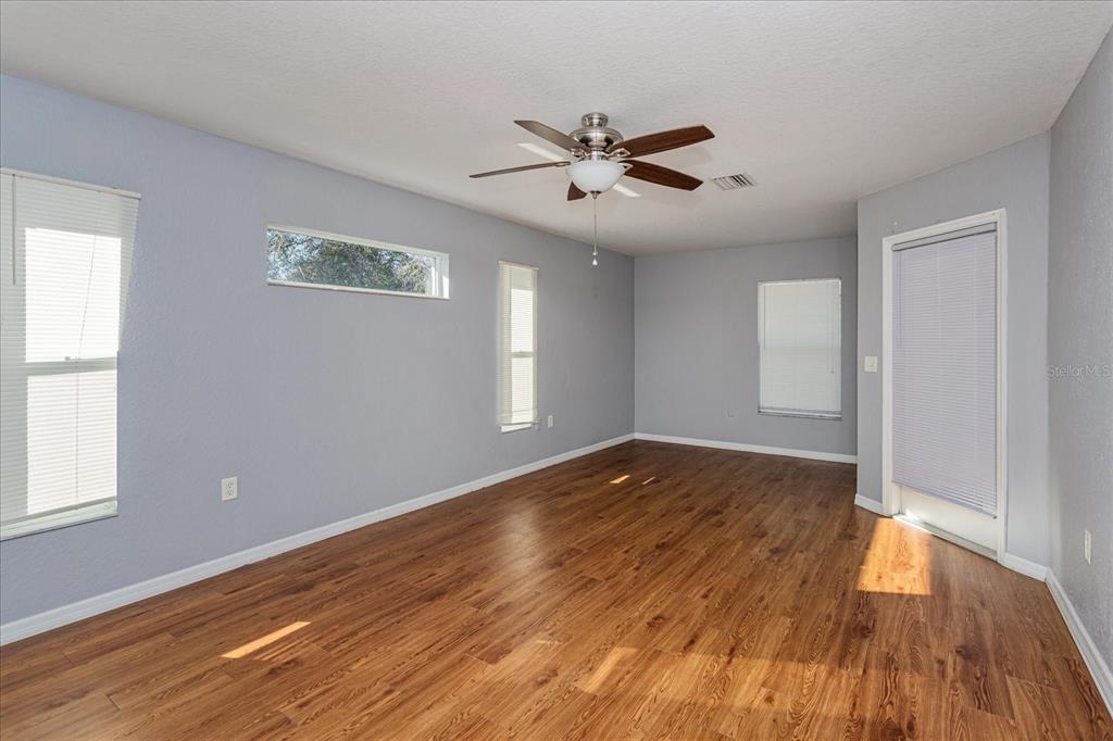 119 Spruce Road Ocala, FL 34472 - Photo 11 of 23 a view of empty room with wooden floor