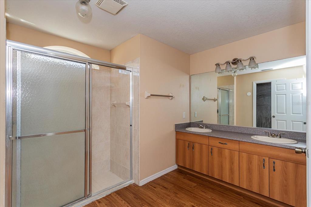 119 Spruce Road Ocala, FL 34472 - Photo 13 of 23 a bathroom with a double vanity sink and mirror