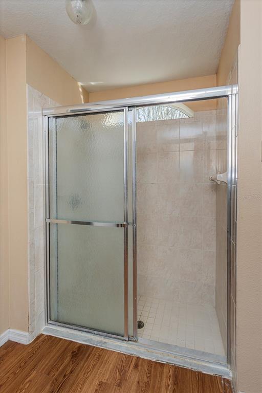 119 Spruce Road Ocala, FL 34472 - Photo 14 of 23 a bathroom with a glass shower door