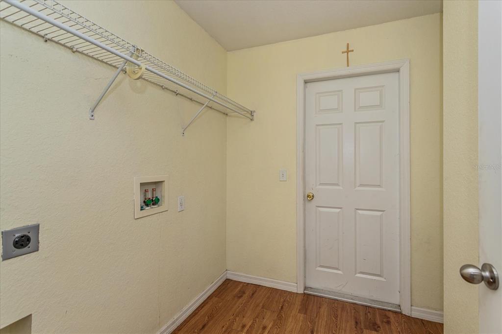 119 Spruce Road Ocala, FL 34472 - Photo 19 of 23 a view of a storage & utility room with wooden floor