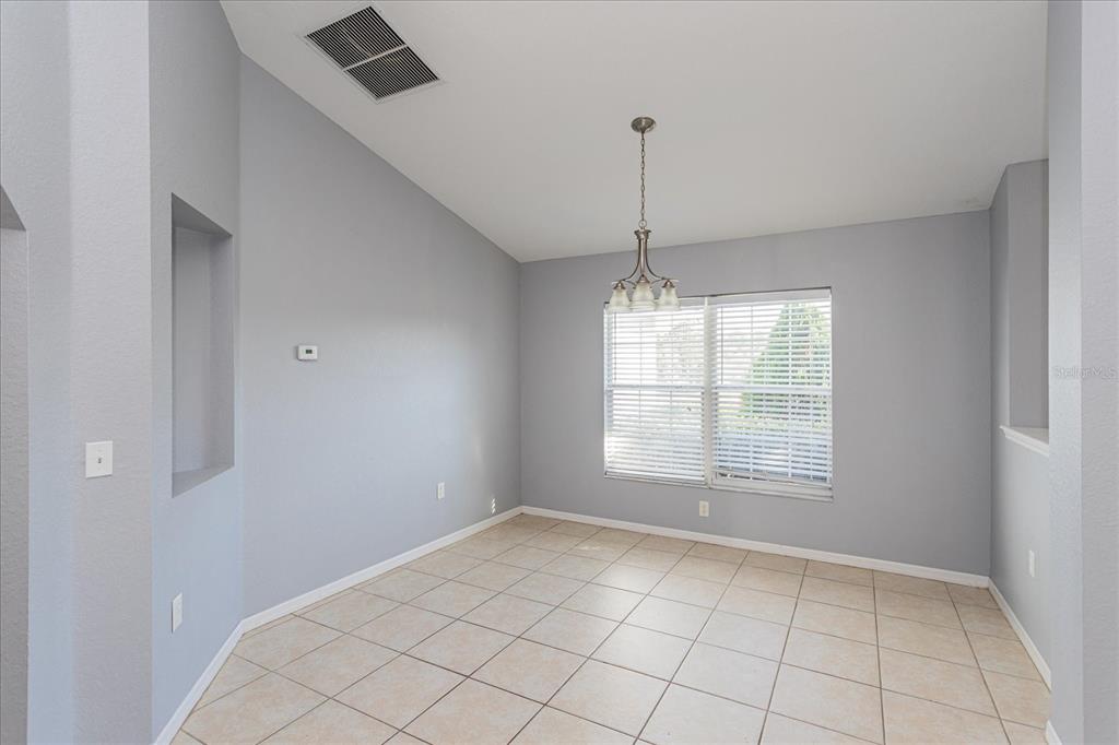 119 Spruce Road Ocala, FL 34472 - Photo 5 of 23 a view of an empty room with a window