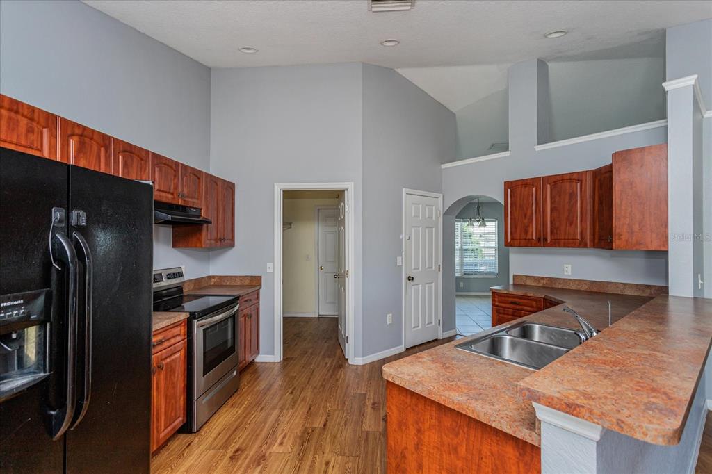119 Spruce Road Ocala, FL 34472 - Photo 9 of 23 a kitchen with stainless steel appliances granite countertop a refrigerator stove and oven