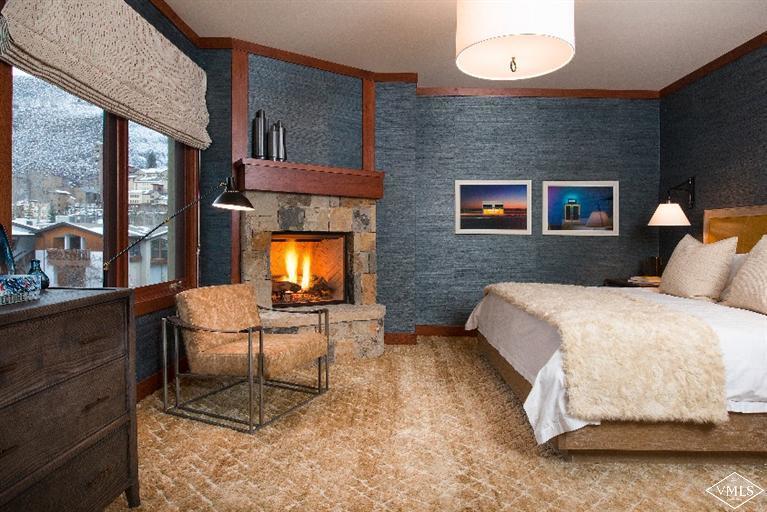 1 Vail Road, Unit 7203 Vail, CO 81657 - Photo 11 of 16 a bedroom with a bed and large windows