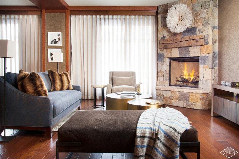 1 Vail Road, Unit 7203 Vail, CO 81657 - Photo 2 of 16 a living room with furniture and a large window