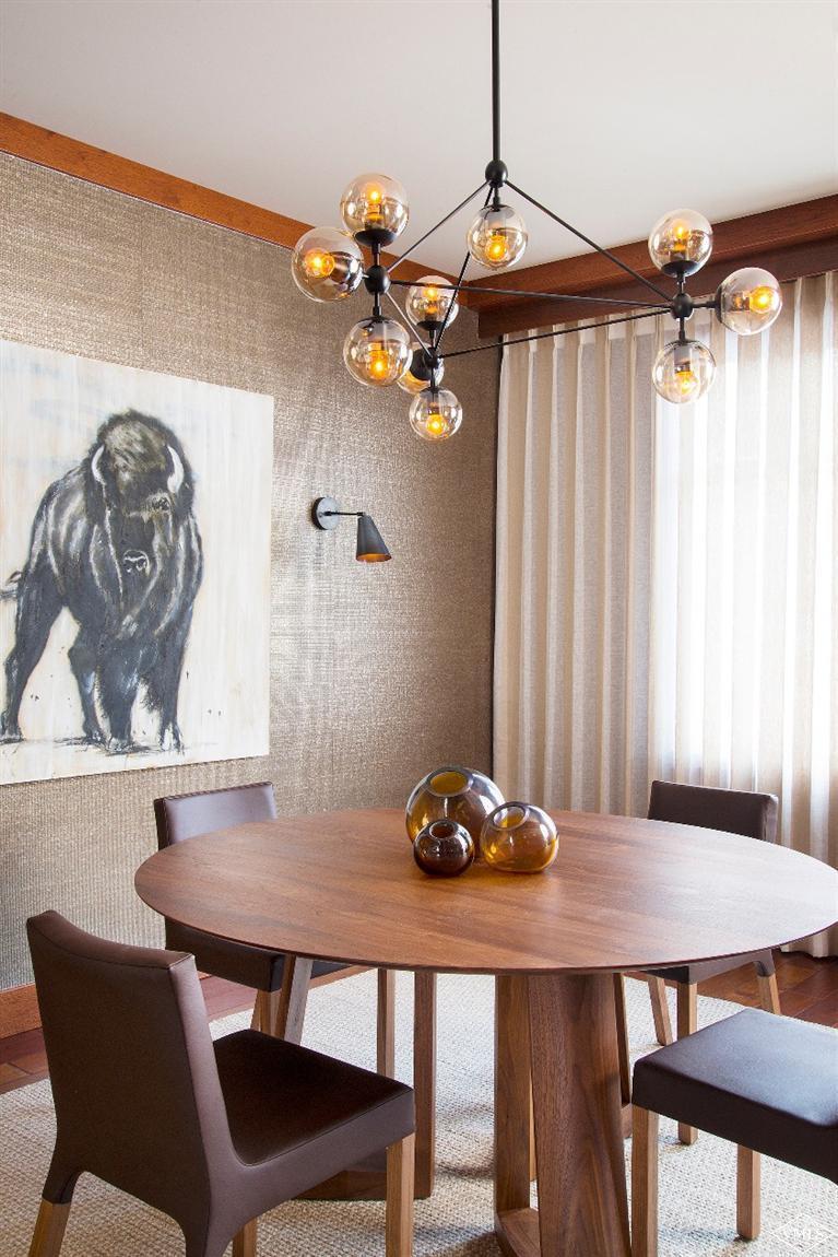 1 Vail Road, Unit 7203 Vail, CO 81657 - Photo 7 of 16 a view of a dining room with furniture and wooden floor