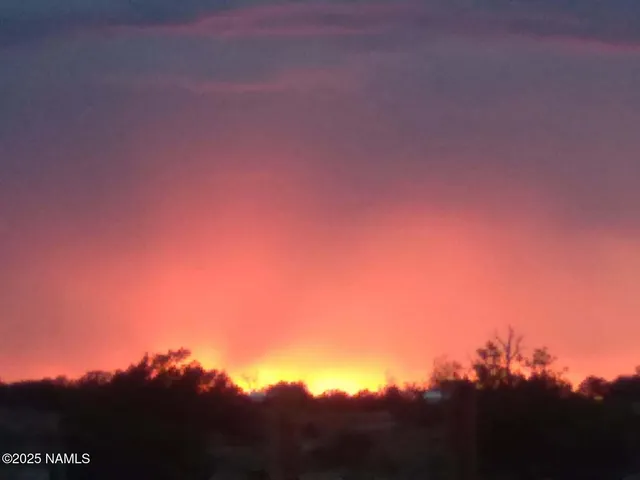a view of a red gate with red umbrella