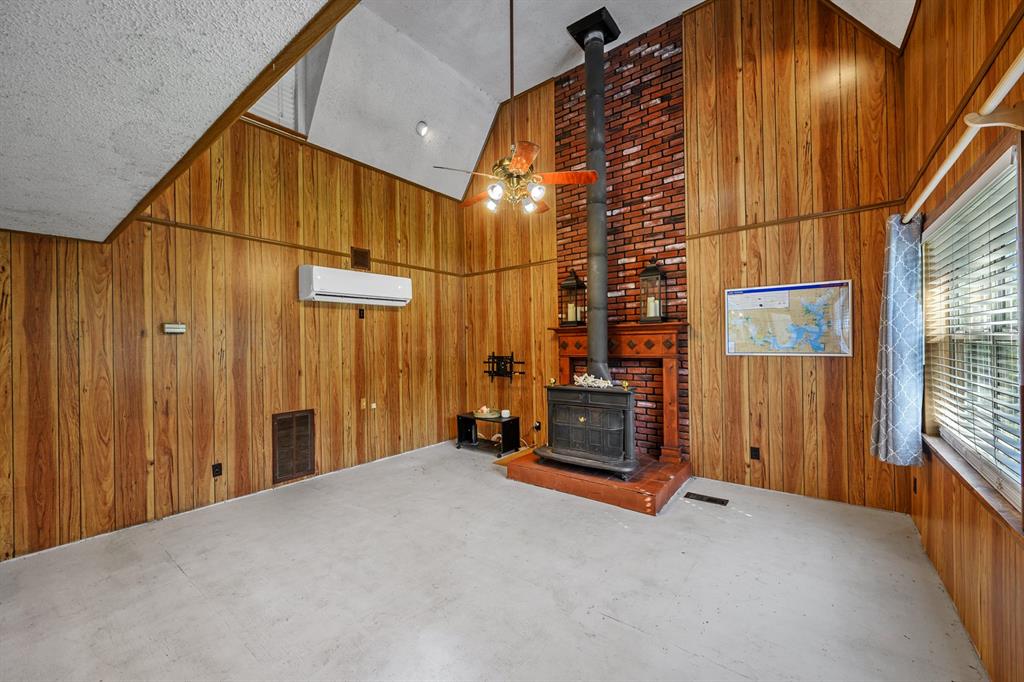 241 Robin Hood Road Gordonville, TX 76245 - Photo 12 of 40 a view of a room with wooden walls