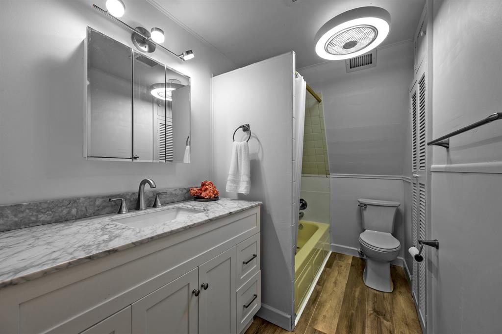 241 Robin Hood Road Gordonville, TX 76245 - Photo 14 of 40 a bathroom with a granite countertop toilet sink and mirror