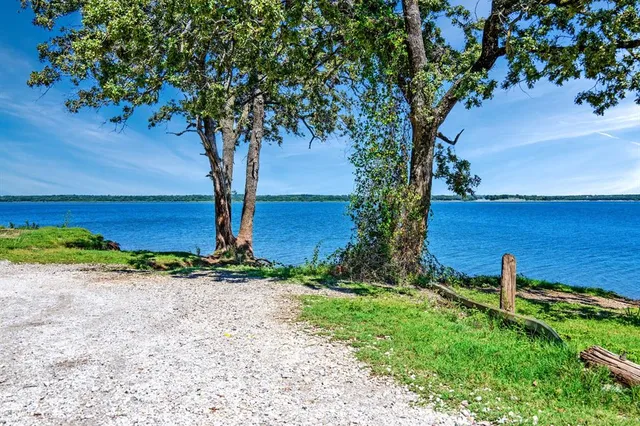 a spacious kitchen with stainless steel appliances granite countertop a sink and cabinets