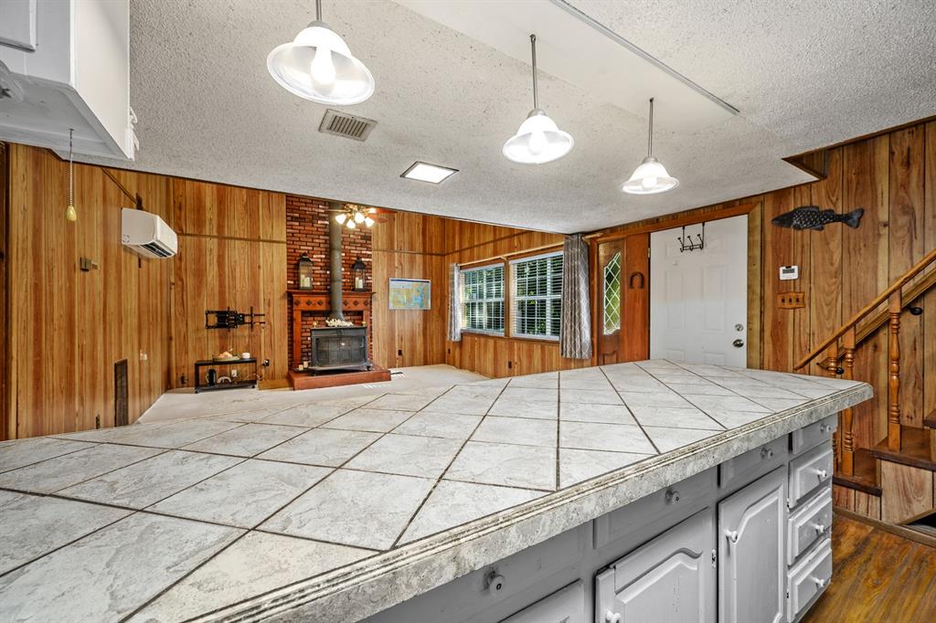 241 Robin Hood Road Gordonville, TX 76245 - Photo 19 of 40 a bed sitting in a spacious bedroom next to a window