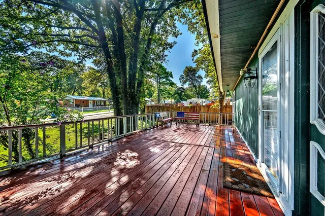 a view of park with deck and wooden floor