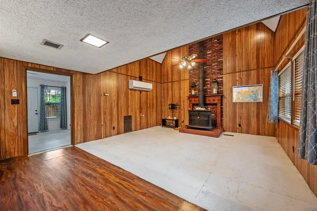 a view of a room with wooden walls