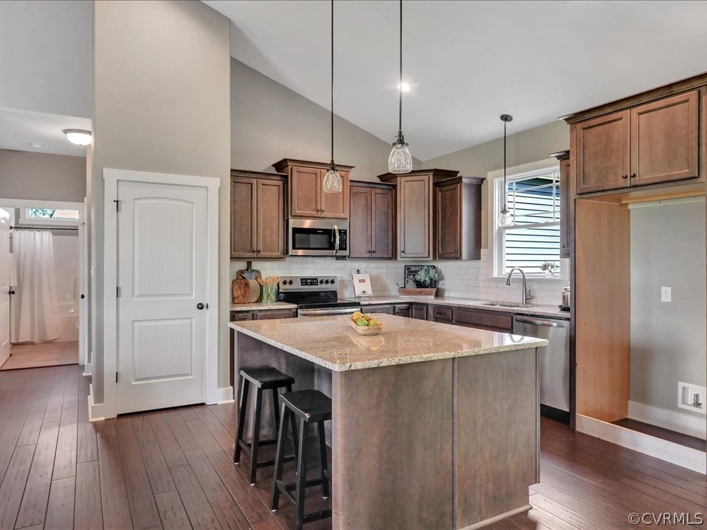 Lot 22 Old Ridge Road Farmville, VA 23901 - Photo 17 of 35 a kitchen with stainless steel appliances granite countertop a sink a stove a refrigerator cabinets and wooden floor