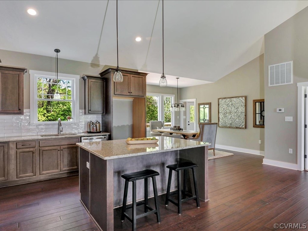 Lot 22 Old Ridge Road Farmville, VA 23901 - Photo 10 of 35 a kitchen with kitchen island granite countertop a sink a center island a stove and a wooden floor