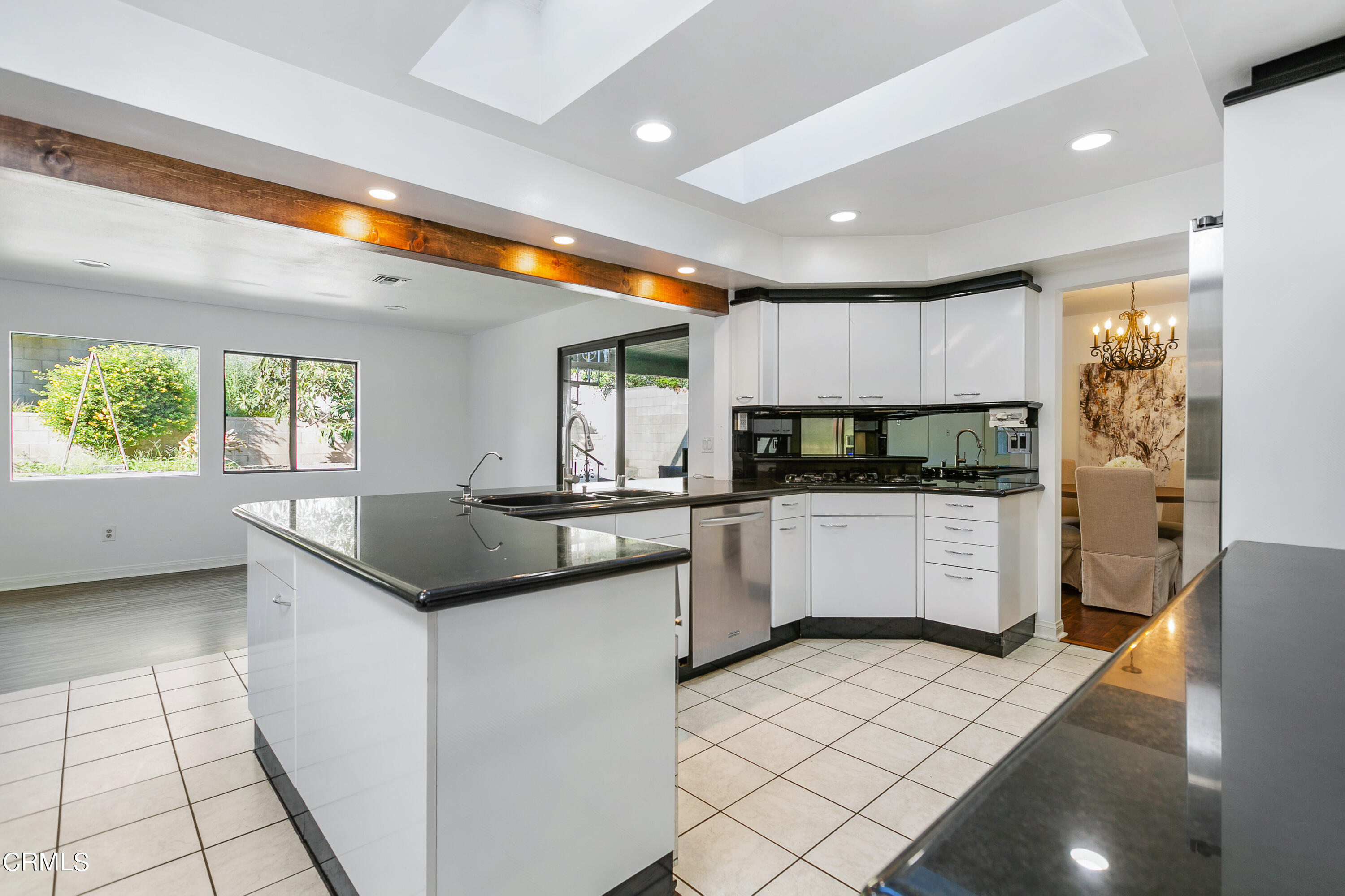3431 Brookridge Road Duarte, CA 91010 - Photo 8 of 26 a kitchen with a sink and white cabinets