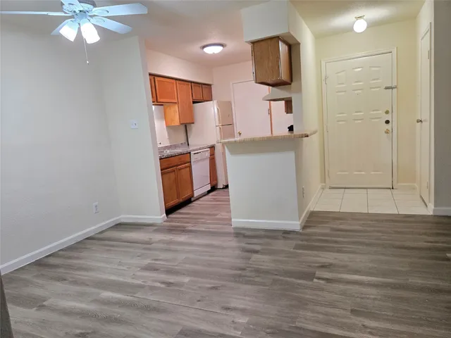 a view of a kitchen from the hallway