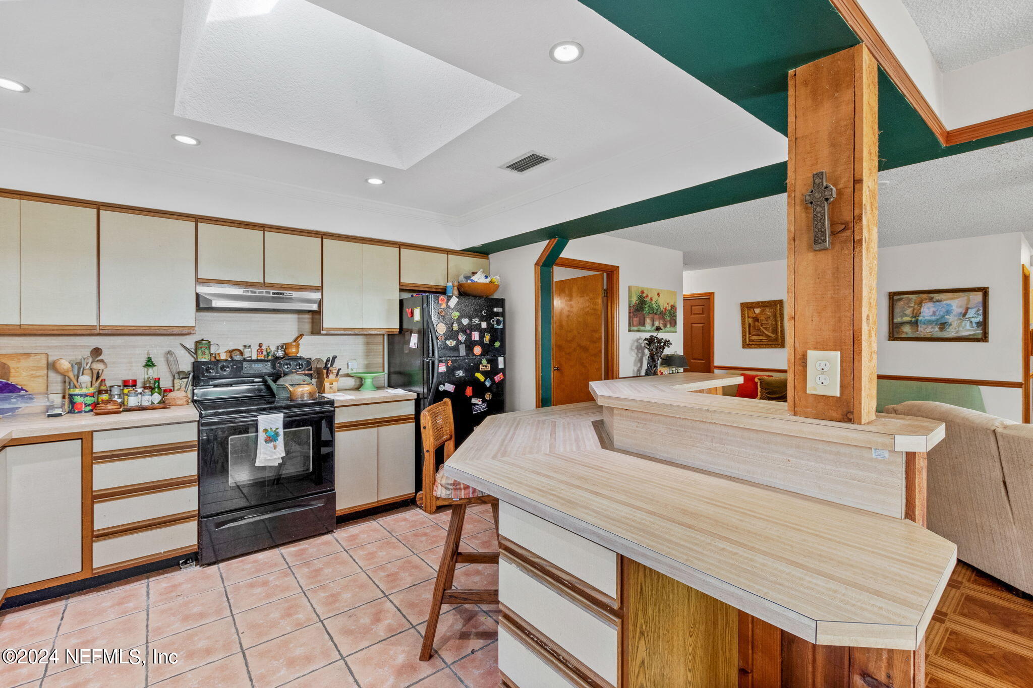 312 Linden Road St. Augustine, FL 32086 - Photo 13 of 40 a room with kitchen island granite countertop lots of counter top space and stainless steel appliances