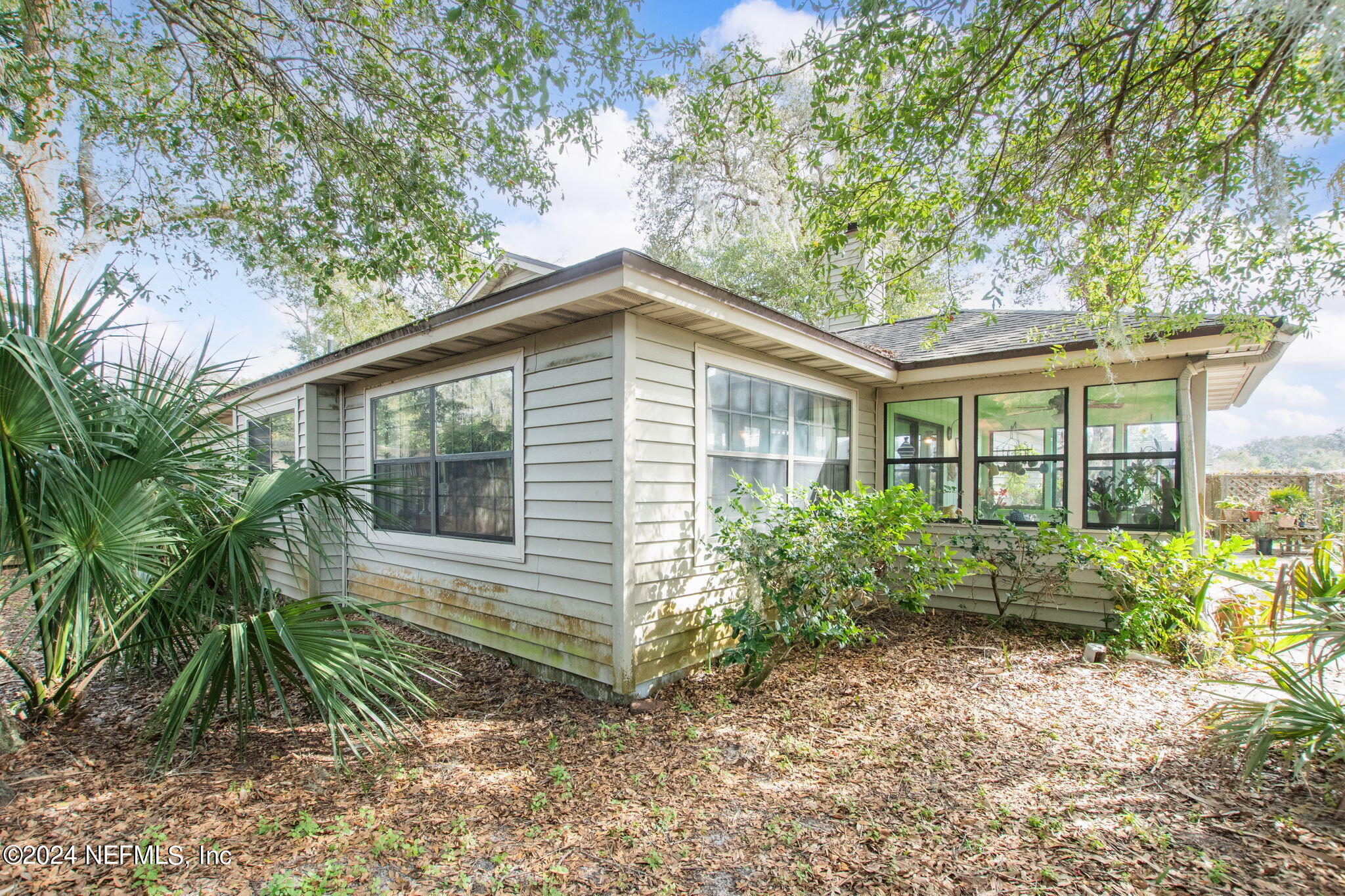 312 Linden Road St. Augustine, FL 32086 - Photo 23 of 40 a front view of a house with a yard