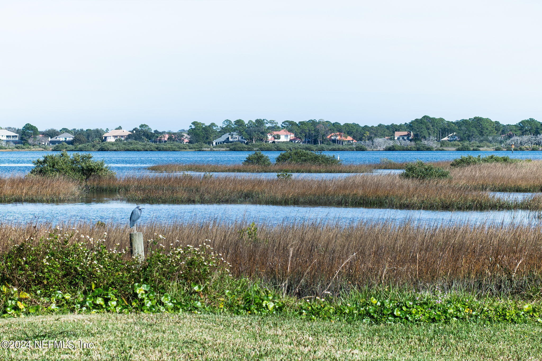 312 Linden Road St. Augustine, FL 32086 - Photo 33 of 40 a view of a lake with houses in the back